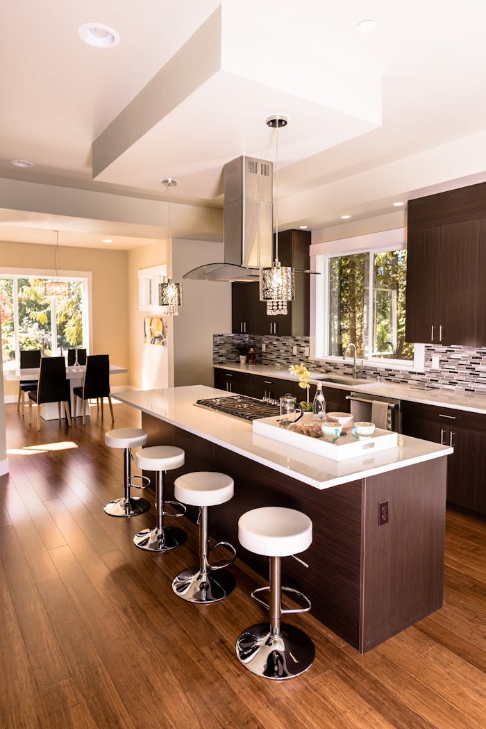 Stylish kitchen featuring an island, bar stools, and contemporary decor.